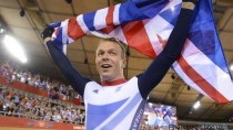 Sir Chris Hoy celebrates his sixth olympic gold medal