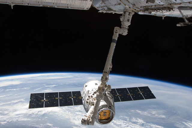A SpaceX Dragon cargo capsule was captured by the International Space Station's robot arm early Sunday.