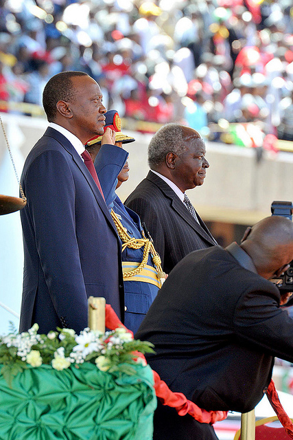 President elect Uhuru Kenyatta(left) and outgoing President Mwai Kibaki observing the National Salute during the inauguration ceremony held at the Kasarani sports complex in Nairobi, Kenya.