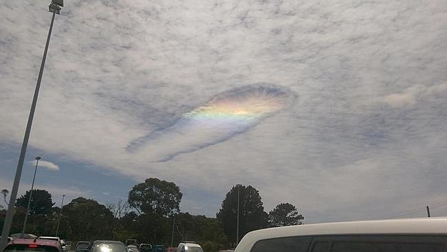 Rainbow Punches a Hole in The Cloud..